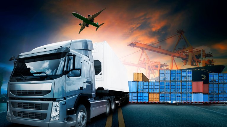 Truck with container port in the background and airplane in the sky