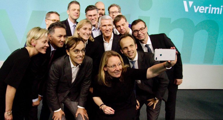 Members of the European identity, registration and data platform Verimi data platform take a selfie together