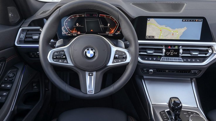 View of steering wheel and cockpit from the perspective of a driver in a BMW