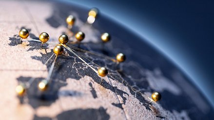 World map with golden pins connected to each other