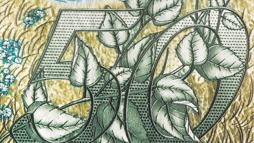 Close-up of intaglio printing on banknote worth 50