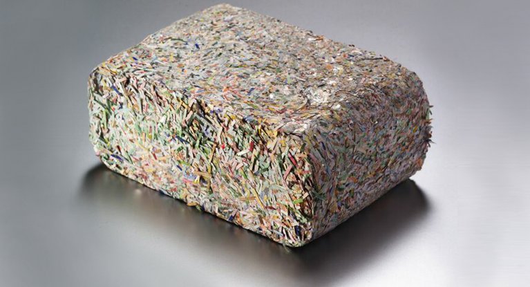 Compact lump of shredded banknotes by BDS® SC systems