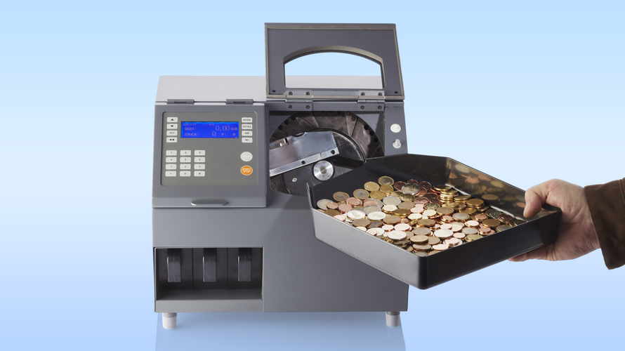 Mixed euro coins are filled from a container into the Coin 200 coin processing system