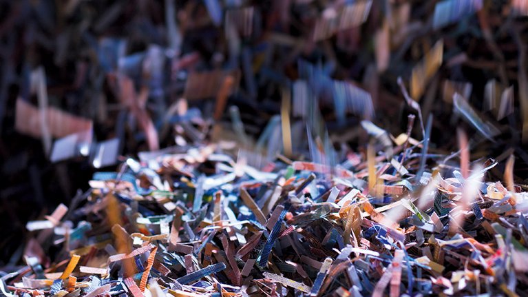 Small snippets from shredded banknotes via a high-speed processing system