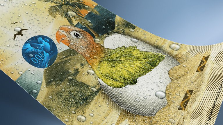 A banknote with an illustration of a hatching parrot chick