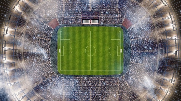 Filled and illuminated soccer stadium from above