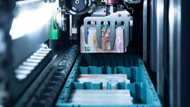Photo from inside a machine that automatically processes banknotes