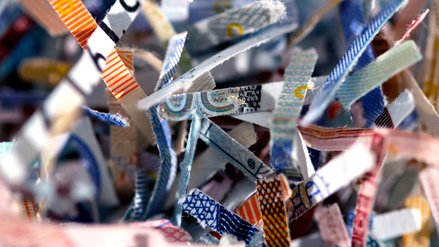 Close up of small snippets of shredded euro banknotes