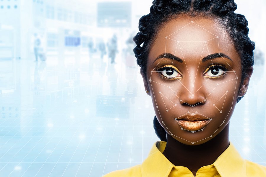 Close up portrait of woman with facial recognition technology. Grid with reference areas marked on face. Young girl against out of focus airport background.