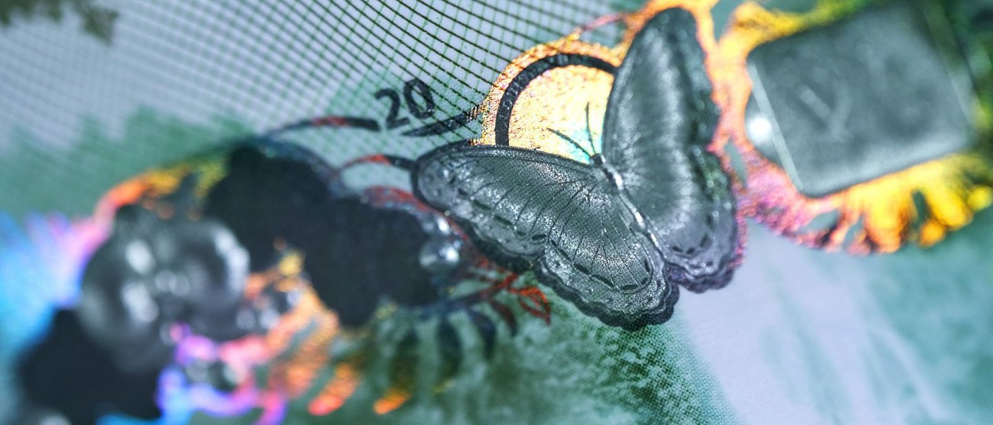 Close-up of a banknote with a butterfly
