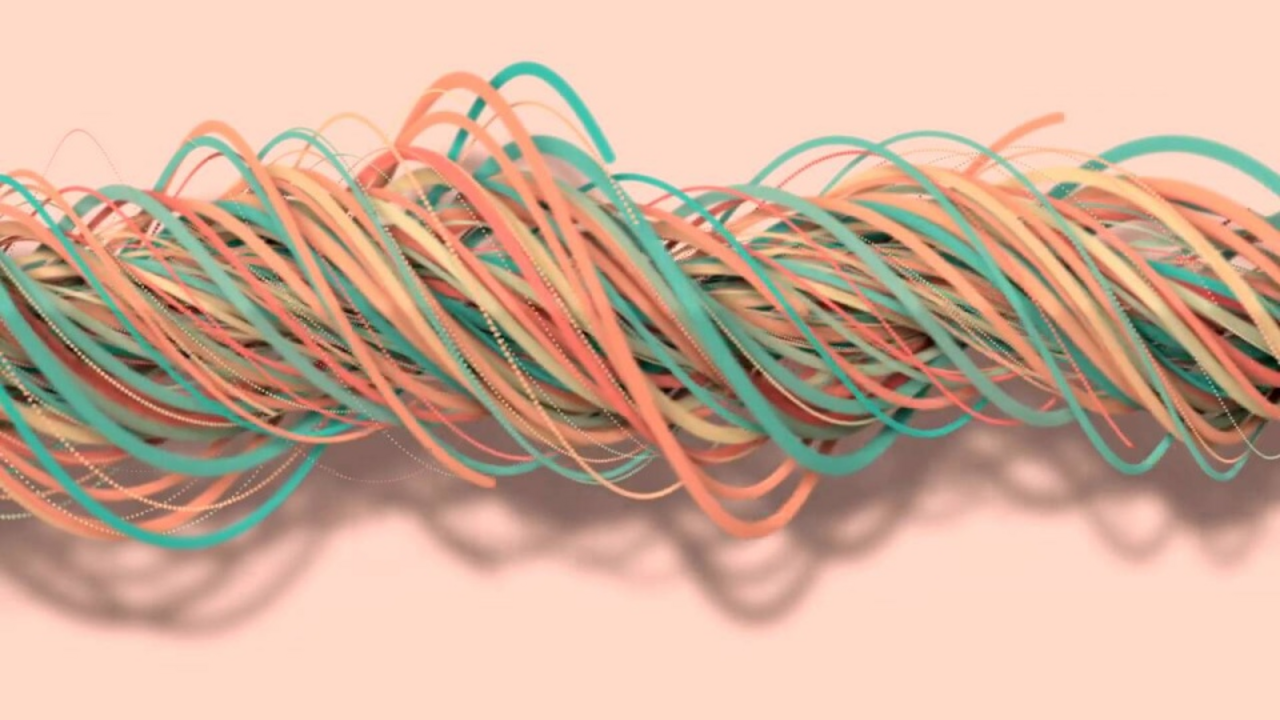 Many colorful paper strips are twisted together into a loose rope