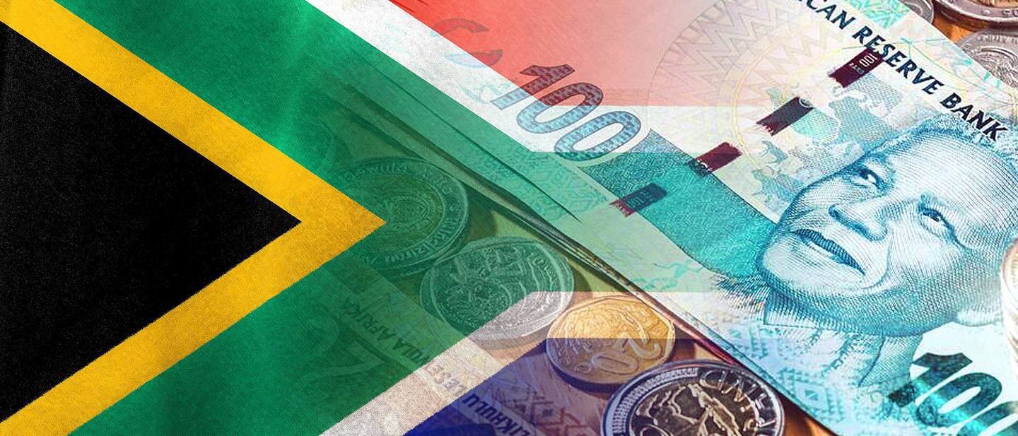 South African cash next to the South African flag