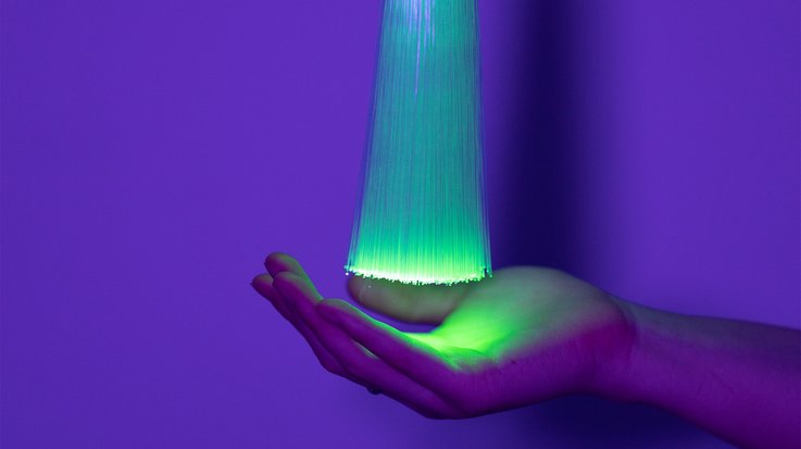 Artificial Intelligence concept a woman’s hand holding bundle of light