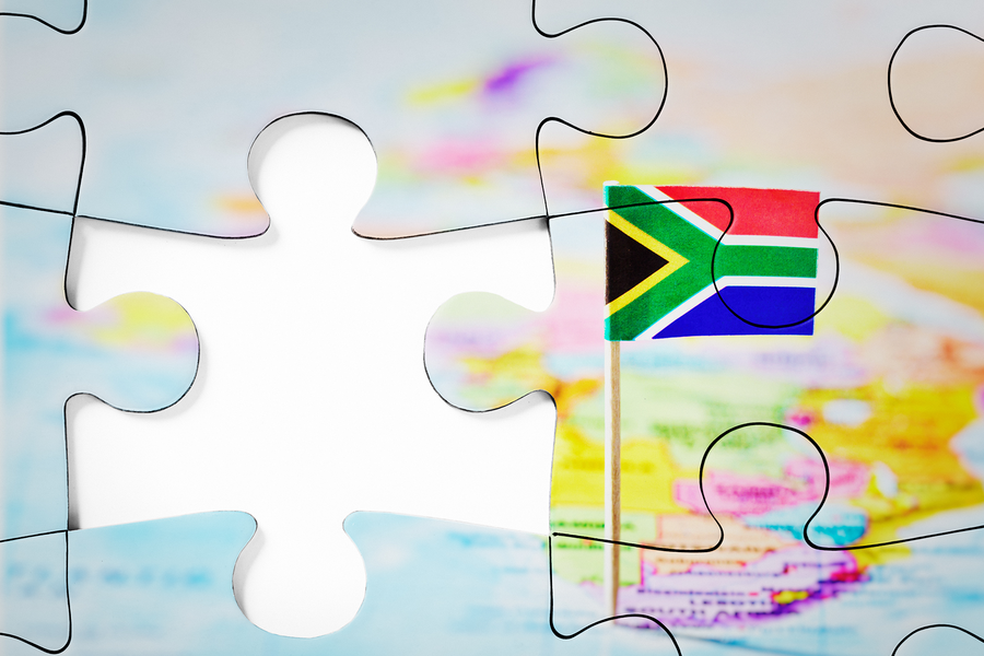Zeigt Fehlendes Puzzleteil eines Puzzels von einer Weltkarte mit Südafrika im Fokus
