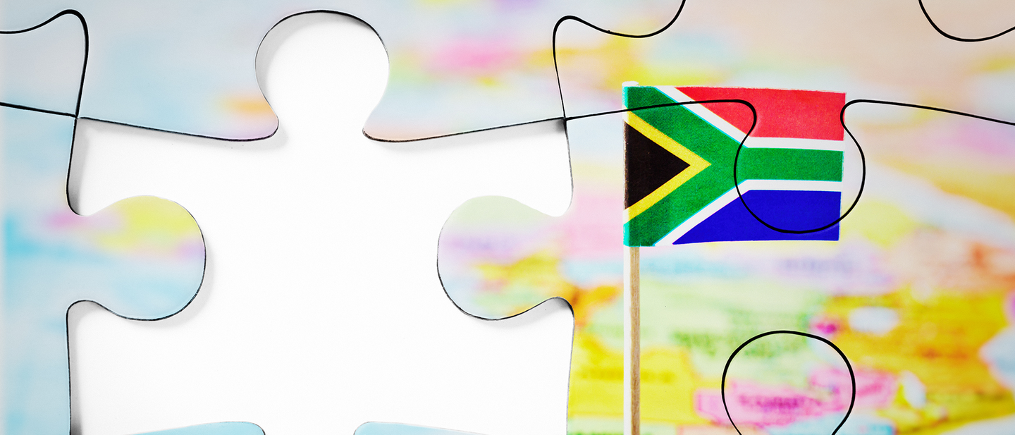 Shows missing puzzle piece of a puzzle of a world map with South Africa in focus