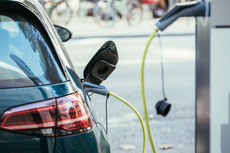 An e-car is charged with electricity at a charge pump