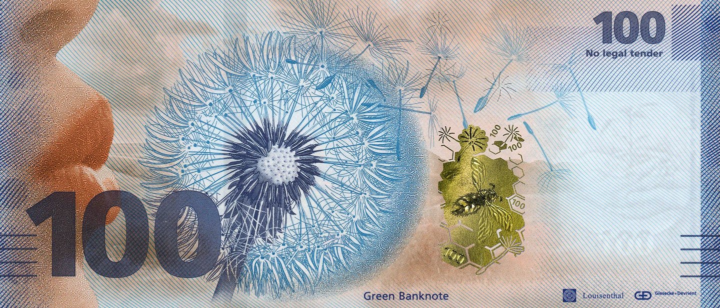 Model of a banknote with a dandelion and the inscription 'Green Banknote'