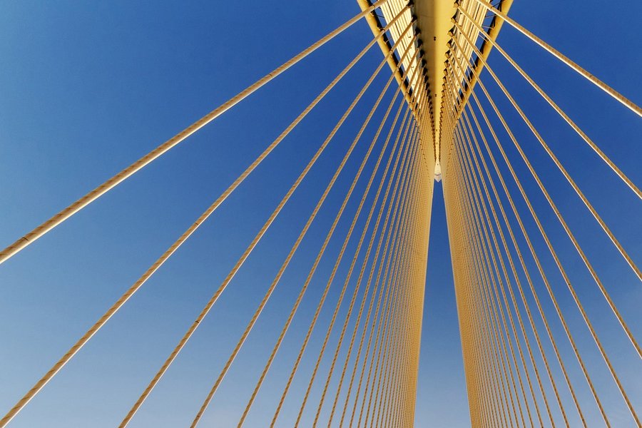 High angle of golden wire bridge with blue sky background representing white label gateway