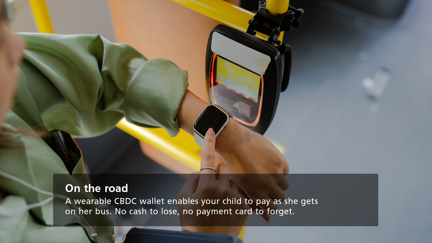 A woman pays for her bus ticket using her smartwatch